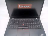 a laptop with a lenovo logo on the screen