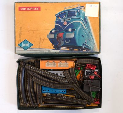 a box with a train set in it on a table