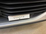 a close up of the front grille of a car with a sticker on it