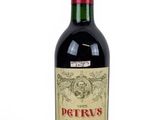 bottle of red wine on a white background with a red cap