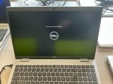 dell laptop computer sitting on a desk with a keyboard and mouse