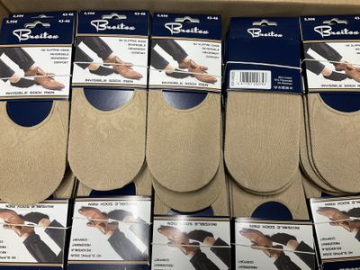 six pairs of men ' s dress socks are in a box