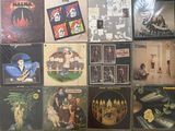 a lot of records on the wall of a room