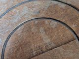 a wooden table with a circular design on it