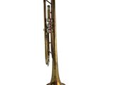 a brass trumpet with a bell on a white background