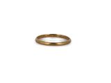 a close up of a gold ring on a white background