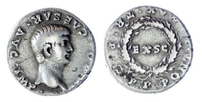 a silver coin with an image of a man on it