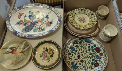 many plates and bowls in a box on the table