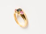 an image of a gold ring with a black diamond and pink tourmaline