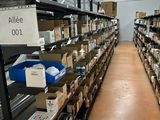 many boxes on the shelves in the warehouse