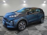 a blue 2020 kia korox is shown in a showroom