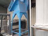 a picture of a large blue machine in a warehouse