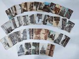 a lot of old postcards on the table