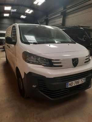 the white van is parked in a garage with other vehicles