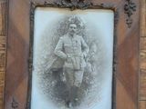 a picture of a man that is sitting in a picture frame