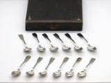 a lot of spoons that are sitting on a table