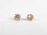 a pair of yellow and white diamond earrings on a white background