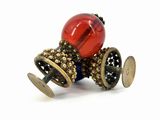 an image of a toy car with a red ball on top of it