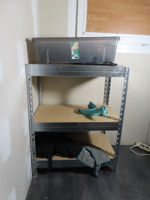 a shelf that has some tools on it in a room