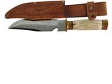 a close up of a knife with a leather sheath on a white background