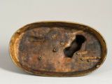 bronze sculpture of a keyhole in the shape of a dog ' s head