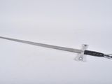 a knife that is laying on a white surface