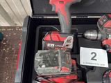 a box with two tools in it on the floor