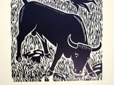 a black and white drawing of a bull in a field
