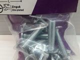a package of screws and nuts on a table