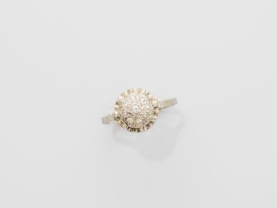 a white gold ring with a cluster of diamonds