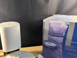 an image of a table with a box and a remote control on it