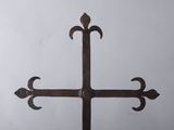 a cross made out of iron with a cross on it