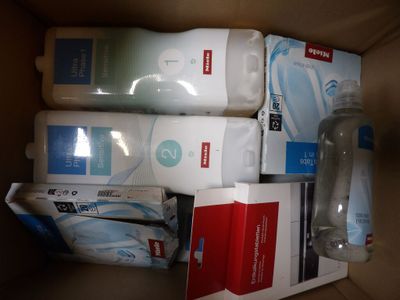 a box with a lot of toiletries and a bottle of lotion