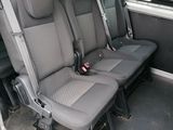 four seats in the back of a van that are empty