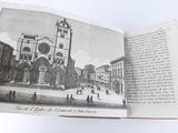 an open book with a picture of a church in it