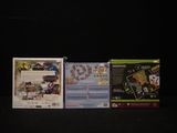 three games on the table with a black background