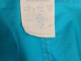 a close up of a blue pants with a tag on it