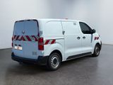 a picture of a white van parked in a room