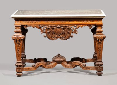 an old wooden table with a marble top on a gray surface
