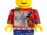 a lego man that is wearing a red shirt and blue pants