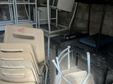 many chairs and tables in a room with a lot of them