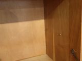 a wooden shelf that has a wooden shelf on top of it