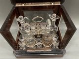 a glass display case with a lot of glass items in it