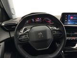 the interior of a car with a steering wheel and dashboard controls