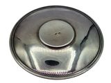 a metal bowl with a hole in it on a white surface