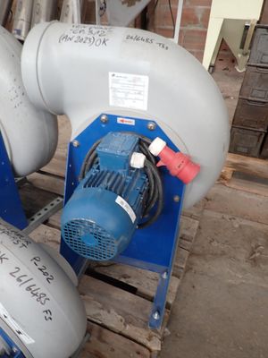 two air compressors sitting on a pallet in a warehouse