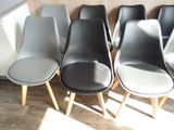 four chairs that are lined up in a row
