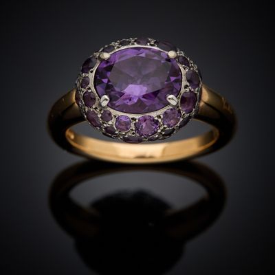 an amethorate and diamond ring set in 18k yellow gold