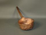 a small wooden bowl with a wooden spoon in it