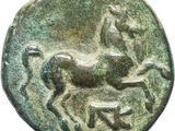a close up of a coin with a horse on it
